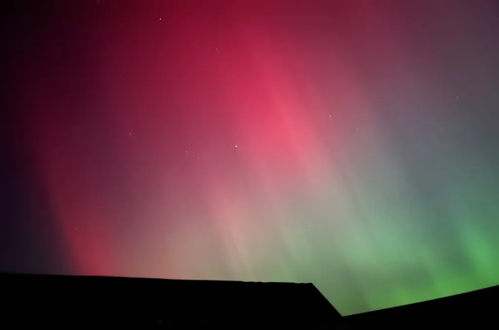Northern lights over barn